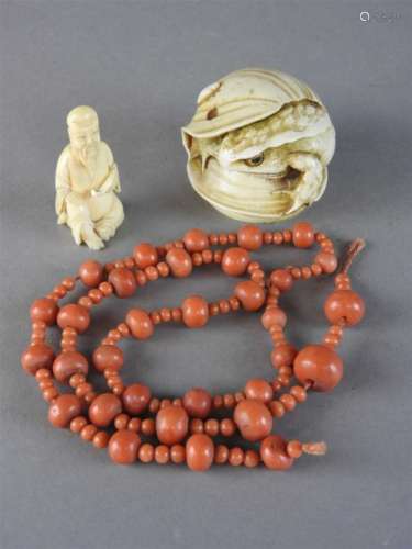A Chinese string of coral beads, Qing Dynasty, 19 th century, composed of large beads, each spaced
