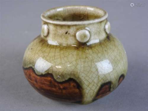 A Chinese Yue Yao ash-glazed jar, Song Dynasty, of squat globular form the neck with six moulded
