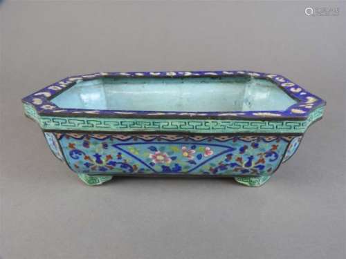 A canton enamel censer, Qing Dynasty, of rectangular form with shaped corners, the body decorated
