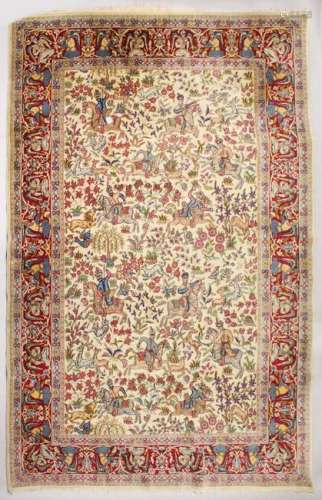 AN INDIAN CARPET, beige ground decorated all-over with