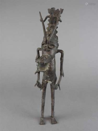 A Benin bronze standing figure of a mythological horned warrior and attendant, Nigeria, 20 th
