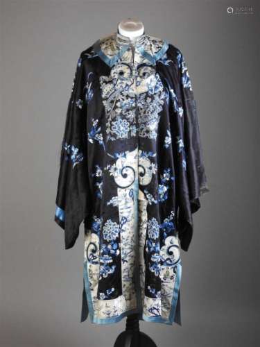A selection of Chinese silk textiles, Qing and 20th century to include: a black silk blue lined robe