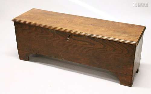 AN 18TH CENTURY ELM SIX PLANK COFFER, on bracket feet.