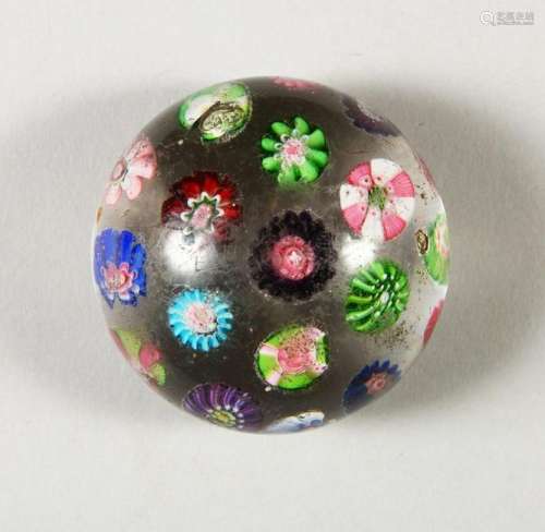 A CLICHY PAPERWEIGHT, with scattered cane decoration.