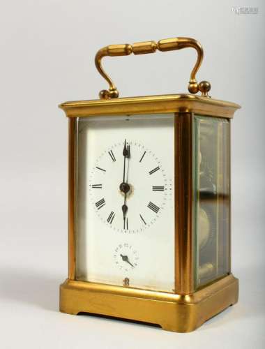 A BRASS CARRIAGE CLOCK, striking on a gong.  5ins high.