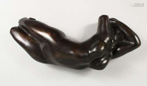 AFTER AUGUSTUS RODIN  A BRONZE RECLINING FEMALE NUDE.
