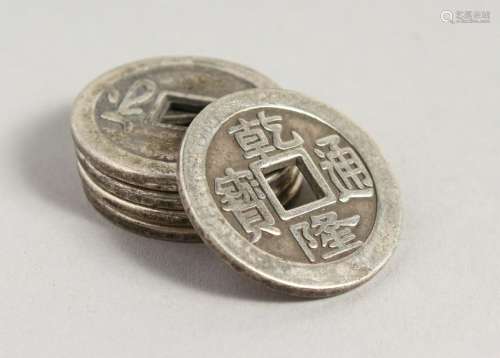 FIVE CHINESE WHITE METAL COINS.  1.25ins diameter.