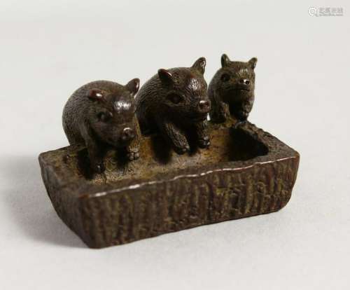 A SMALL JAPANESE MODEL OF PIGS AT A TROUGH.  2ins wide.