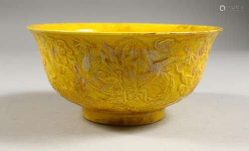 A YELLOW GROUND CIRCULAR BOWL, with moulded decoration.