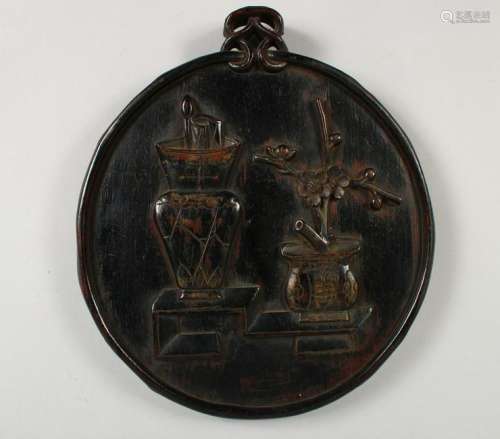 A CHINESE RELIEF CARVED HARDWOOD PLAQUE.  13ins x