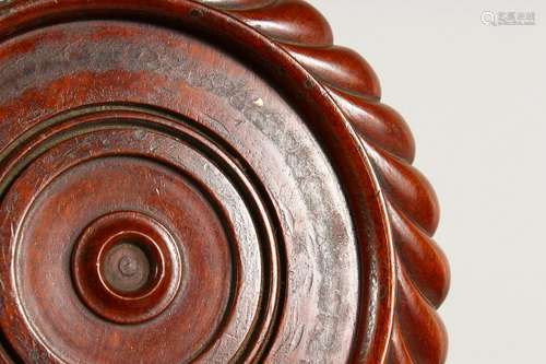 A 19TH CENTURY TURNED AND CARVED MAHOGANY CIRCULAR