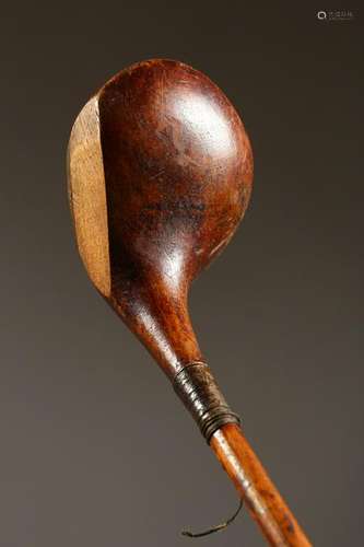 AN EARLY HICKORY SHAFTED GOLF CLUB.  45ins long.