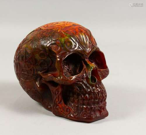 AN AMBER STYLE MODEL OF A SKULL.  7ins long.