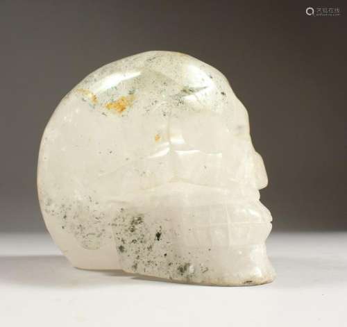 A LARGE ROCK CRYSTAL MODEL OF A SKULL.  8ins long.