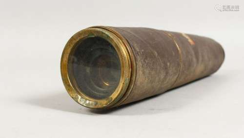 AN OLD LEATHER COVERED BRASS TELESCOPE.  10.5ins long.