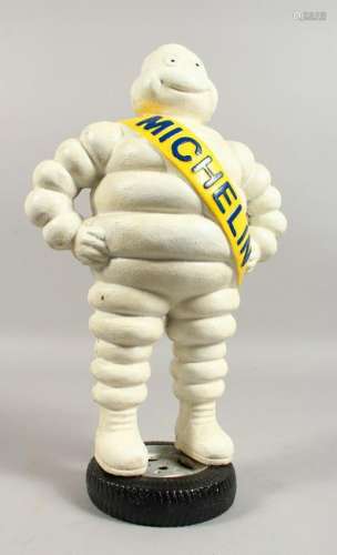 A CAST IRON MODEL OF THE MICHELIN MAN.  15ins high.