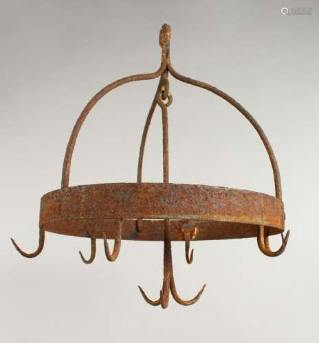 AN EARLY WROUGHT IRON GAME HANGER.  11.5ins diameter.