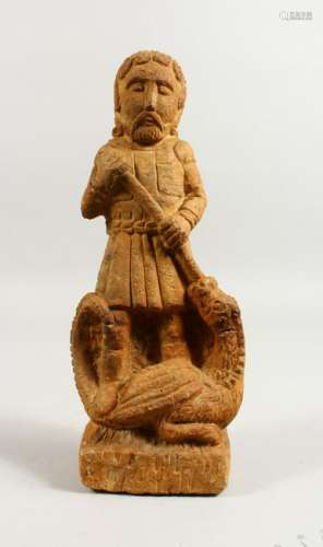 A CARVED STONE FIGURE, depicting George slaying the