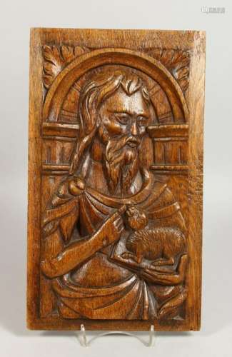 AN EARLY CARVED OAK PANEL, a male figure holding a