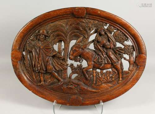 A GOOD EARLY OVAL PIERCED AND CARVED PANEL, depicting