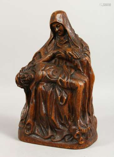 A CARVED OAK RELIGIOUS GROUP, Mary Magdalene Supporting