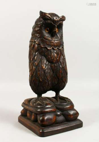 A GOOD LARGE BLACK FOREST CARVED OWL with glass eyes.