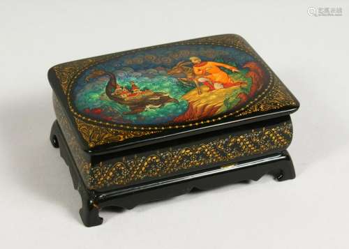 A RUSSIAN BLACK LACQUER BOX AND COVER, the lid with a