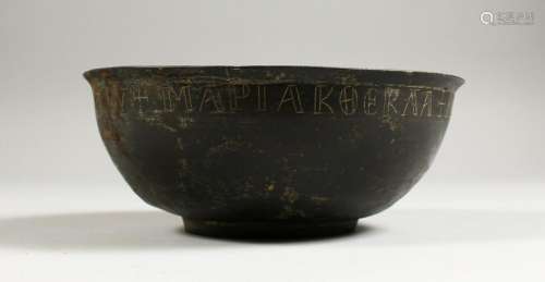 A BYZANTINE BRONZE BOWL, the rim with incised
