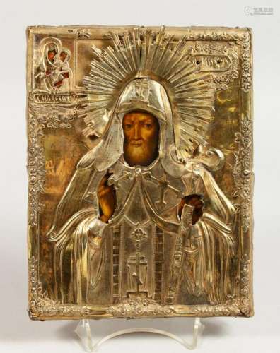 A RUSSIAN SILVER GILT ICON.  Priest and Madonna & Child