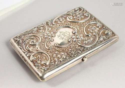 A SILVER CARD CASE WITH EMBOSSED DECORATION.  4.25ins x