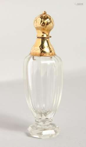 A CUT GLASS PERFUME BOTTLE, with a gold top.  4ins