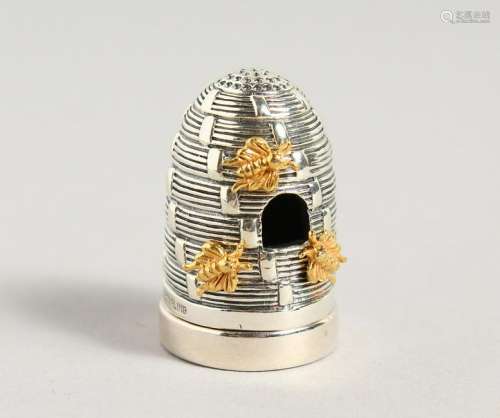 A CAST SILVER BEEHIVE PIN CUSHION.