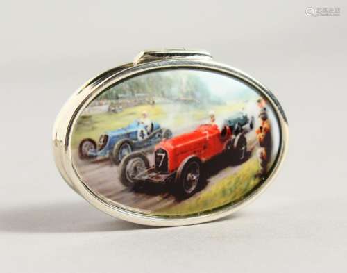 A SILVER OVAL PILL BOX, with enamel lid depicting a