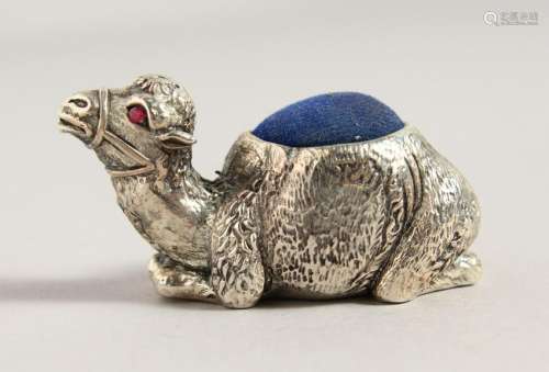 A CAST SILVER PLATE CAMEL PIN CUSHION.  2ins long.