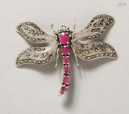 A SILVER AND RUBY MARCASITE DRAGONFLY BROOCH.