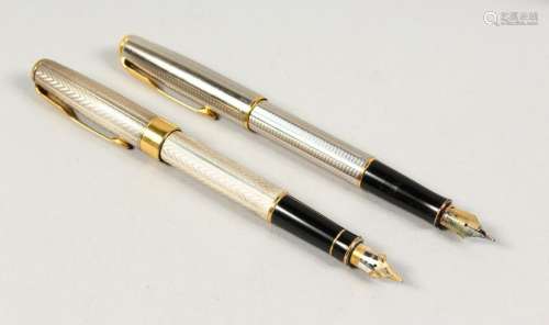A GOOD SET OF TWO PARKER PENS with gold nibs.