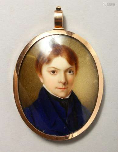 AN EARLY 19TH CENTURY PORTRAIT MINIATURE of a young boy