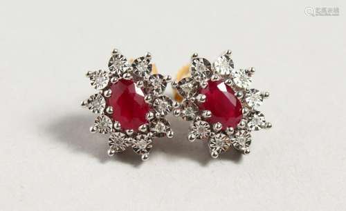 A PAIR OF 9CT GOLD, RUBY AND DIAMOND CLUSTER EARRINGS.