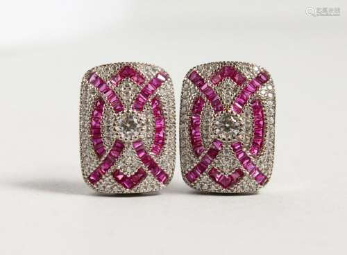 A PAIR OF SILVER DECO STYLE EARRINGS.