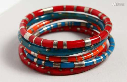 FIVE SILVER AND ENAMEL BANGLES.