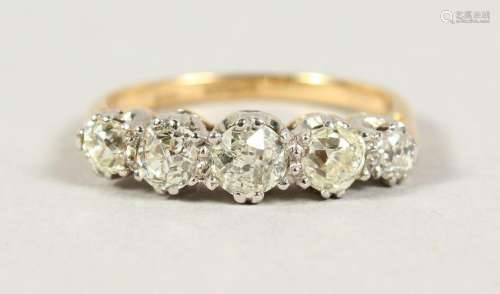 AN 18CT GOLD AND PLATINUM MOUNTED FIVE STONE DIAMOND