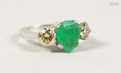 AN 19CT WHITE GOLD THREE STONE PEAR SHAPED EMERALD AND