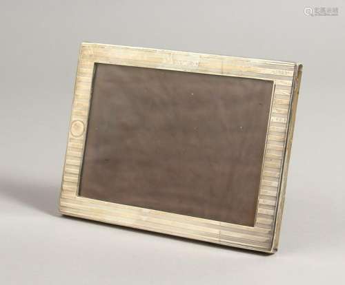 A RECTANGULAR ENGINE TURNED PHOTOGRAPH FRAME.  Chester