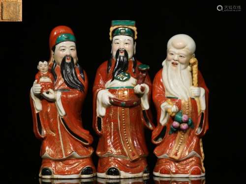 A Set of Three Chinese Porcelain Figures of Buddha