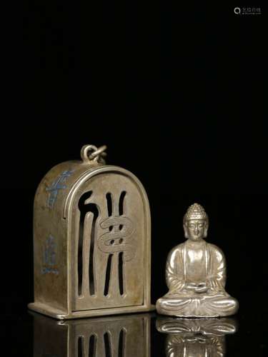 A Chinese Carved Silver Figure of Buddha with Niche