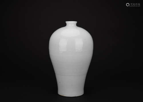 Ming dynasty white glaze vase with carved plum blossom pattern