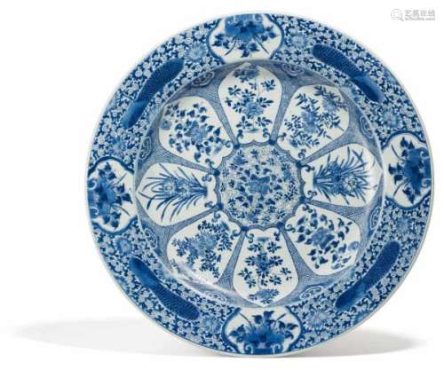 LARGE DISH WITH FLOWERS OF THE FOUR SEASONS. China. Qing dynasty. Kangxi period [...]