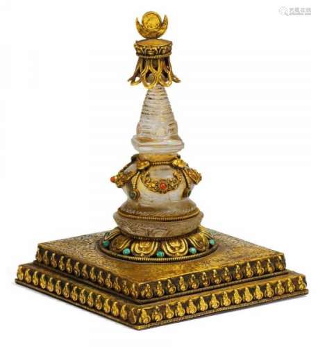 RELIC DEPOSITORY STUPA. Tibet/Nepal. Base and tip gilt bronze, Stupa from crystal [...]