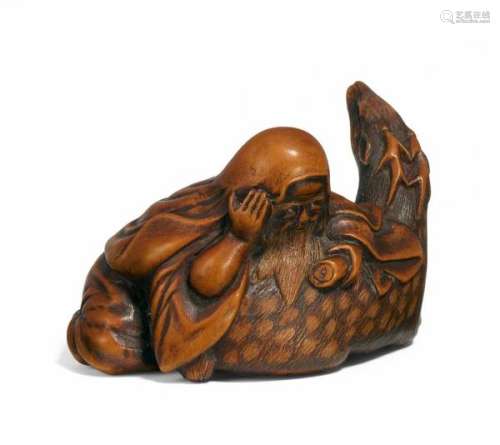 NETSUKE: JURÔJIN WITH SHIKA DEER. Japan. 19th c. Boxwood, finely carved. The bearded [...]