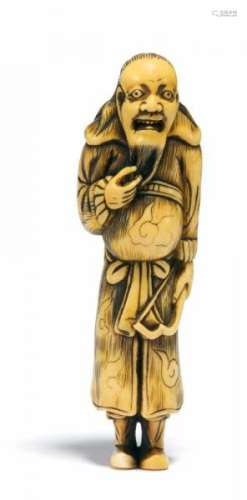 NETSUKE OF A MONGOLIAN ARCHER. Japan. 18th c. Ivory, engraving stained dark. Back [...]